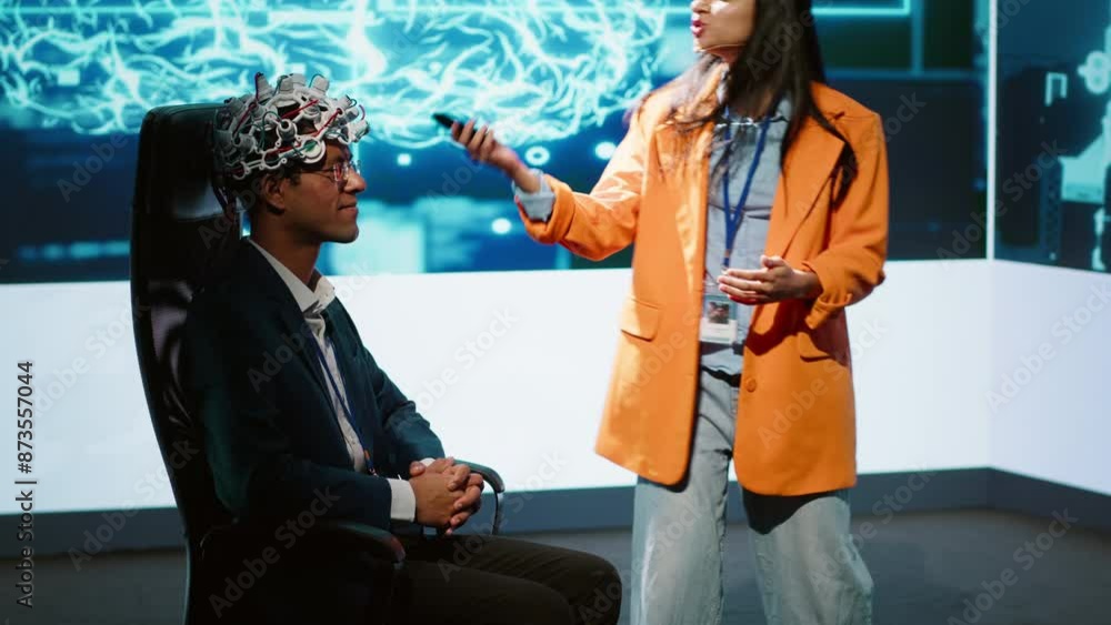 Poster speaker does eeg headset presentation during tech convention, demonstrating successful implementatio