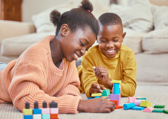 Obraz premium Kids, playing and building blocks in home for growth, child development and learning for motor skills. African children, toys and colorful puzzle in education, skill and cognitive ability for bonding