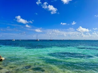 seascape of guadeloupe in the french west indies with view of sailing boats on a turquoise lagoon
