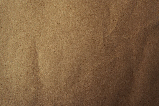 Classic eco environmental friendly brown tone color creased envelope document blank recycled paper texture background with space minimal style