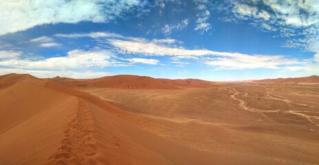 Naklejka premium Dunes in the Namib Desert with clouds