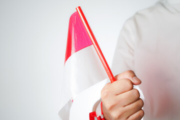 hands waving the flag excited to celebrate Indonesia's independence day on August 17