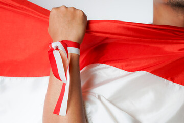 Excited Asian youth celebrate Indonesia's independence day on August 17 by waving the flag