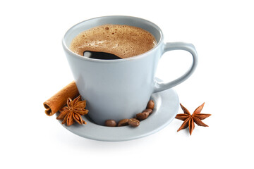 Cup of tasty coffee with cinnamon, beans and star anise on white background