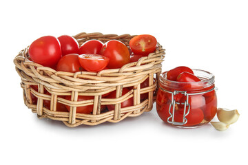 Jar of pickled tomatoes and garlic on white background