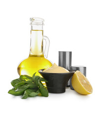 Bowl of fresh mayonnaise and ingredients on white background