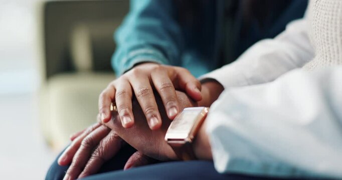 Holding hands, family and people on sofa for empathy, support and compassion in home. Calm, love and closeup of gesture for comforting, sympathy and affection for bonding, care and relationship