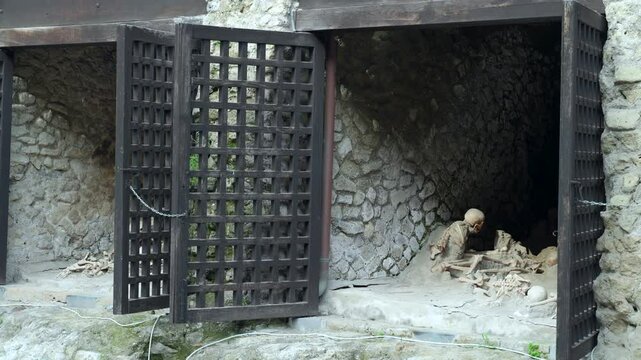 Human skeleton remains covered in volcanic ash inside the boatsheds of the ancient Roman archeological town of Herculaneum.