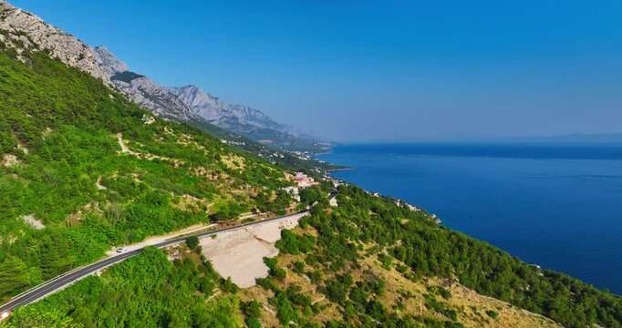 Drone following a coastal road on the Makarska riviera summer day in Croatia