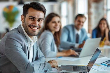 cohesive group of business people and planners work collaboratively as a team in the office, demonstrating seamless connectivity in their process and shared knowledge.