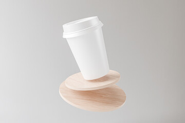 White blank take away coffee cup on top of cylindrical wooden coaster for mockup presentation design rendering photoshop blank template with circular lid