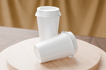 White blank take away coffee cup on top of cylindrical wooden coaster for mockup presentation design rendering photoshop blank template with circular lid