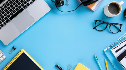 Blue Desk Workspace with Laptop, Notebooks, and Coffee