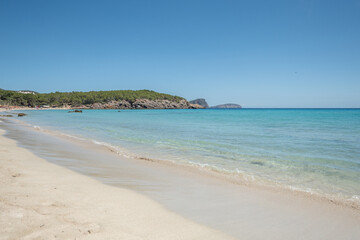 Crystal clear turquoise waters of the beaches of Ibiza in summer