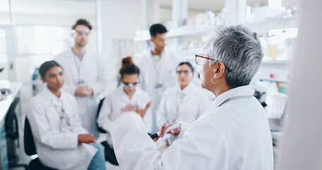 Presentation, research and team of scientists in laboratory with mentor for bio medical internship....