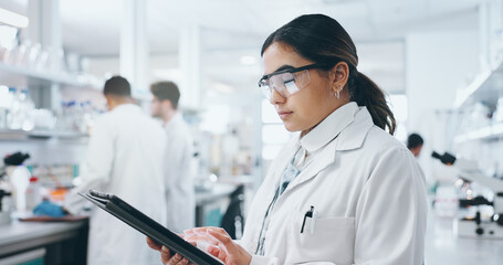 Laboratory, woman scientist and tablet for medical research, diagnosis and results with tech....