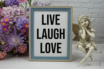 Live Laugh Love text message motivational and inspiration quote with flowers decoration on white...