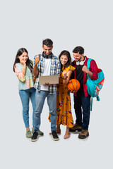 Fototapeta premium Indian asian college students using laptop isolated against white background