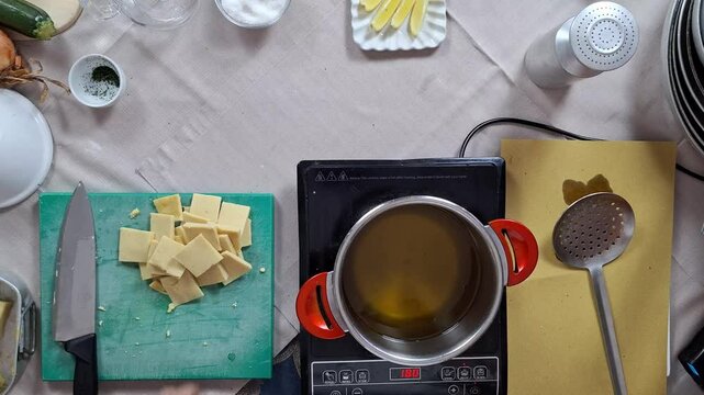 Chef checks temperature of oil before dropping in cube blocks of panelle into pot