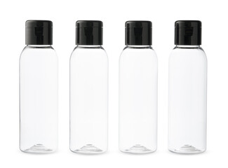 Four Clear Plastic Bottles With Black Caps on a White Background