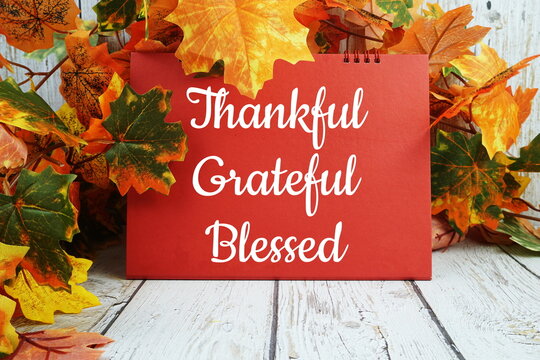 Thankful, grateful and blessed inspirational words  with maple leaf decoration