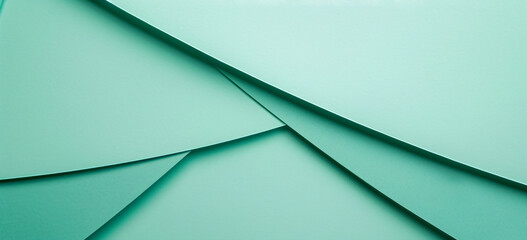 Fototapeta premium Photo of a minimalist mint green background with geometric shapes for design or text space. Web banner with copy space on the right in the style of minimalism.
