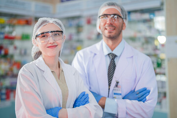 Male and female doctor scientists stand with confidence. With specialized skills in conducting scientific experiments in a laboratory full of test substances and chemical products for making medicines