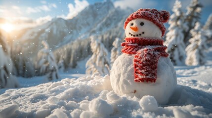 Obraz premium Snowman made of snow in a red hat and scarf against the backdrop of a winter mountain natural landscape