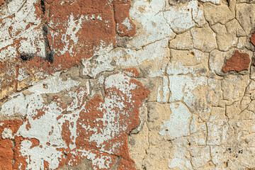 Old cracked plaster of a building facade as a vintage background.