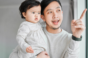 Father, baby and talking by window together, bonding and communication for love in relationship....