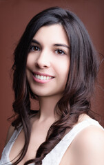 Beautiful latin woman smiling with long brown hair