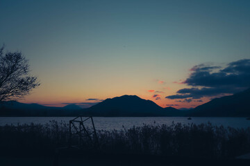 view of lake and mountain in evening