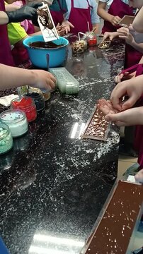 Master chocolatier shows a master class on making chocolate. vertical video