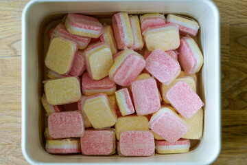 Dishwasher tablets in a box in the kitchen before use when washing dishes