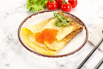Russian pancake with red caviar