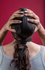 Naklejka premium Inclusivity shown by man’s hands on woman’s head