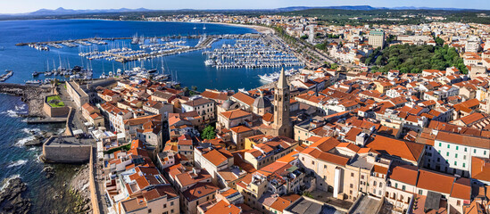 Sardegna (Sardinia) island landmarks. Charming historic Alghero.  Aerial drone panoramic view of...