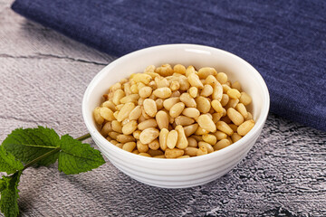 Peeled cedar nut in the bowl