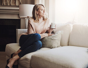 Obraz premium Mature woman, reflection and coffee in home for peace, relax and hot beverage for memory on weekend. Female person, espresso and planning for future in living room, thinking and tea for comfort