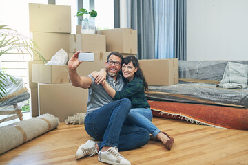 Couple, happy and new house selfie in lounge, smile and photography with moving boxes in apartment....