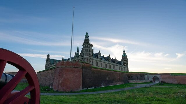 Timelapse of the famous castle Kronborg in Helsingor north of Copenhagen in Denmark. A wheel of an old canon is in the foreground