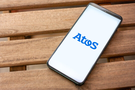 Atos logo, a global leader in digital transformation, providing IT services, consulting, and cybersecurity solutions, displayed on smartphone screen