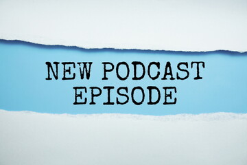 New Poscast Episode message written on blue paper with torn paper background