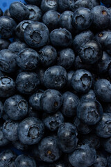 Fresh ripe blueberries as background, top view. Healthy food concept