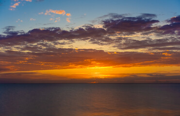 Bright colourful dawn in summer on the Baltic Sea. A couple of minutes before sunrise. Beautiful sea background. High quality photo