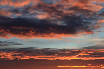 Sunrise in the sky with clouds.