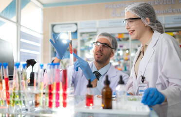 Pharmacist and chemical scientist doing antibiotic trials and testing in the laboratory