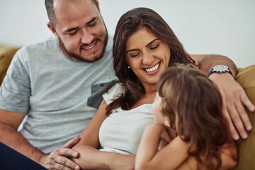 Happy, girl and parents on sofa with love for bonding, relationship trust and development support in family home. Mom, dad and daughter on couch with smile for growth, calm weekend and relax together