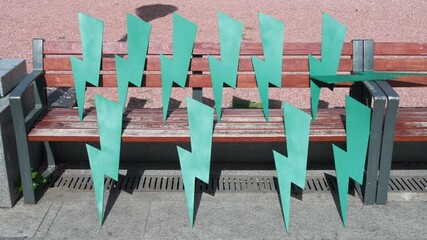 Cut-out Lightning bolts inspired by the Polish women's power movement are seen on a bench during a demonstration to protest against the extreme right and fascist movements in Europe.