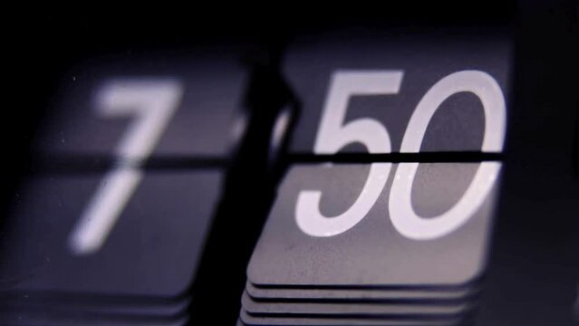 Split-Flap Clock Close-Up - 4K Ultra HD Video of Time Change from 7:39 to 8:12